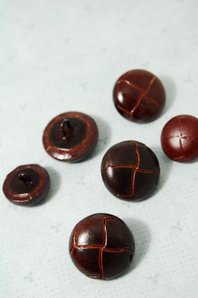 Braided leather button